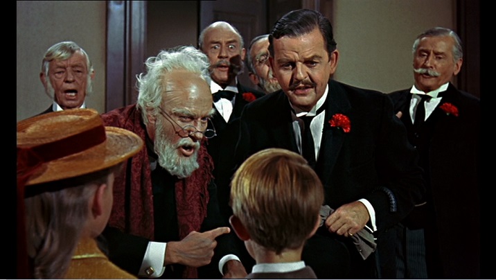 Mister Dawes Padre (Dick Van Dyke), Mr. Dawes figlio (Arthur Malet) e Mr. George Banks (David Tomlinson) nel film Mary Poppins del 1964.